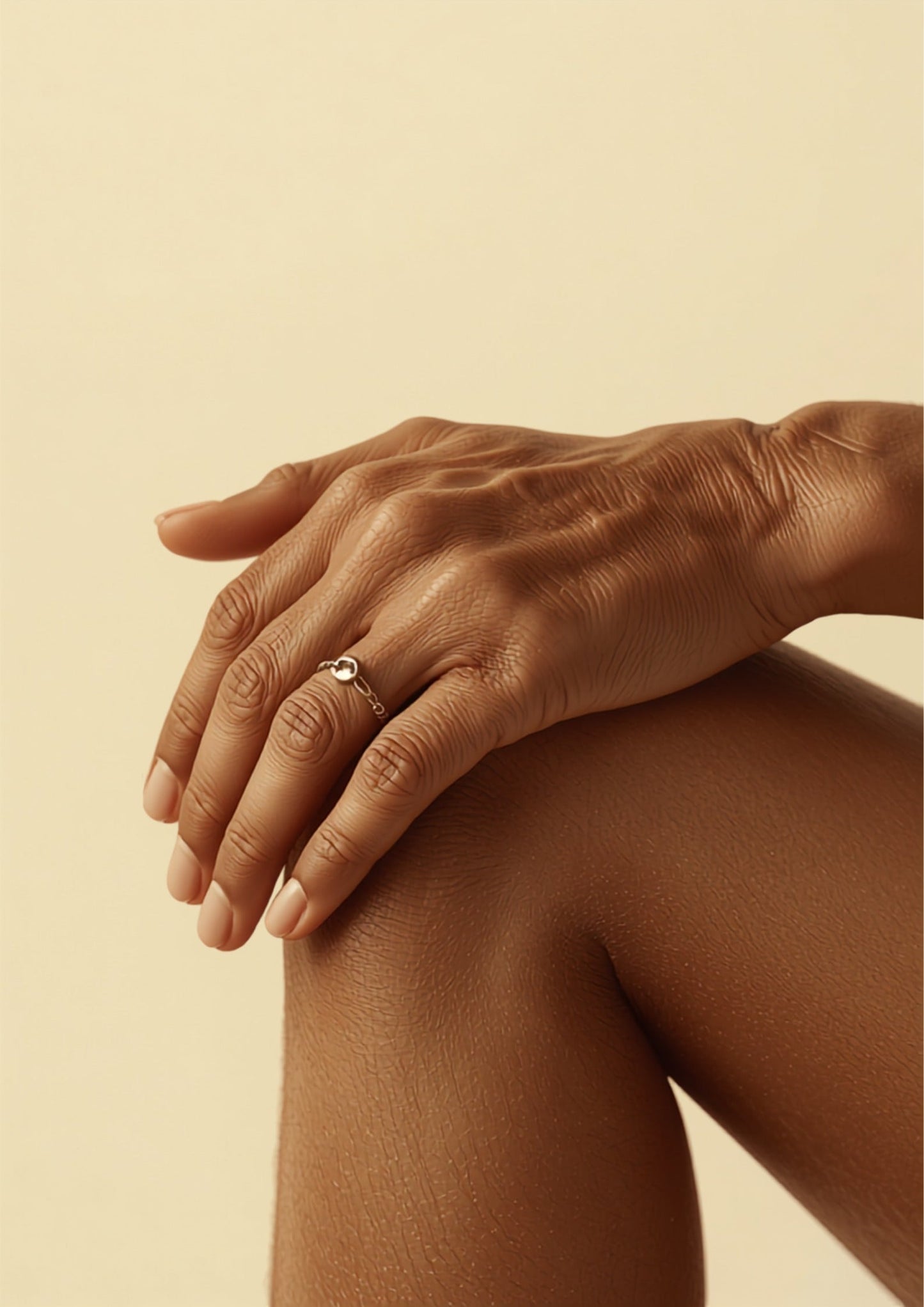 Elderly hands resting on knee — MSM for joint health