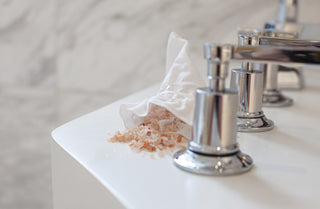 Moon Salts in a linen pouch on a bath