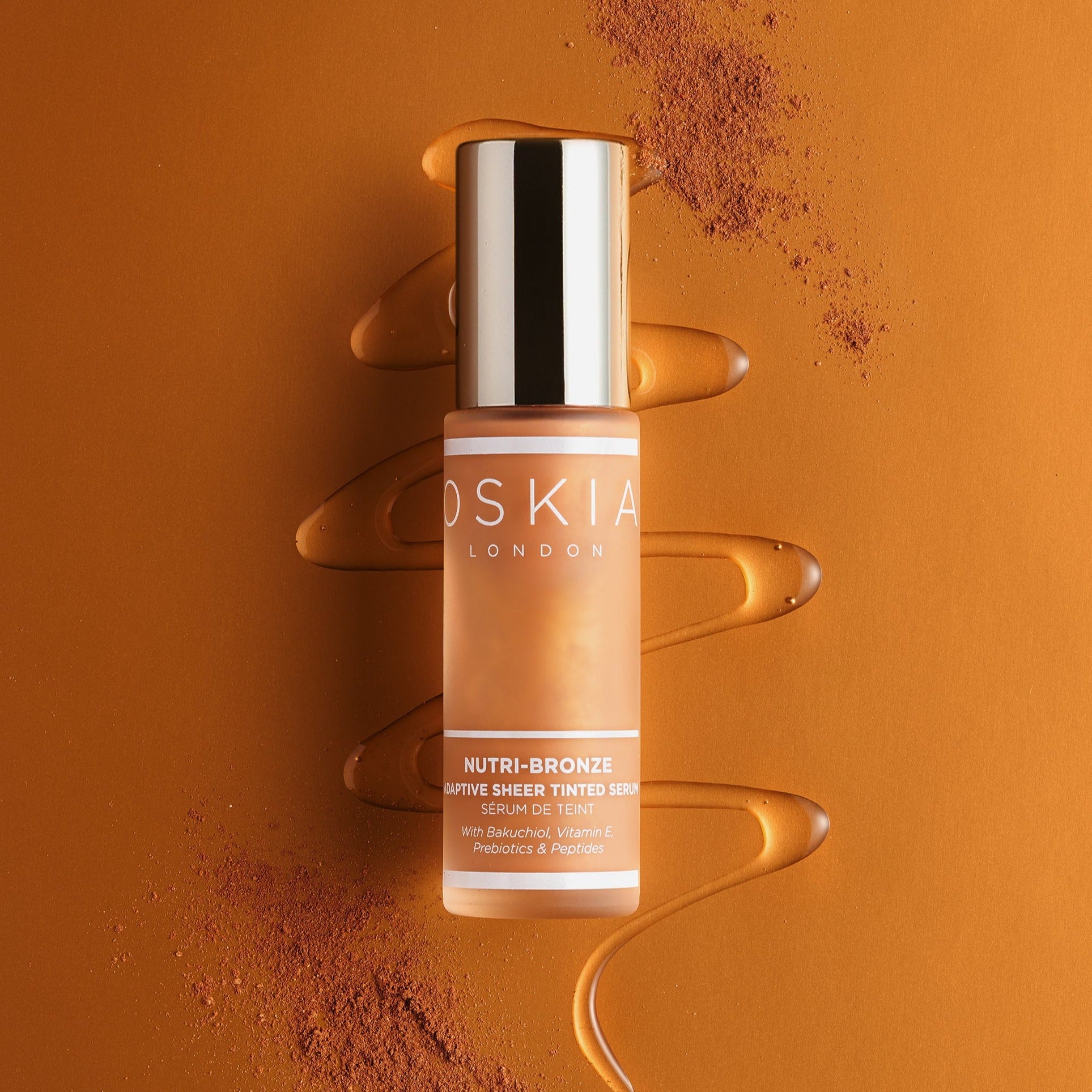 Nutri Bronze Tinted Serum with anti-ageing and glow-boosting properties. Image of bottle surrounded by ingredients. 