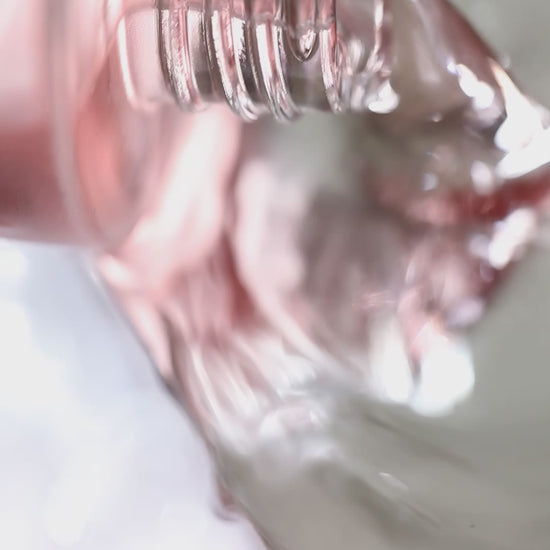 Video of Floral Water Pure Roses Toner pouring out of bottle.