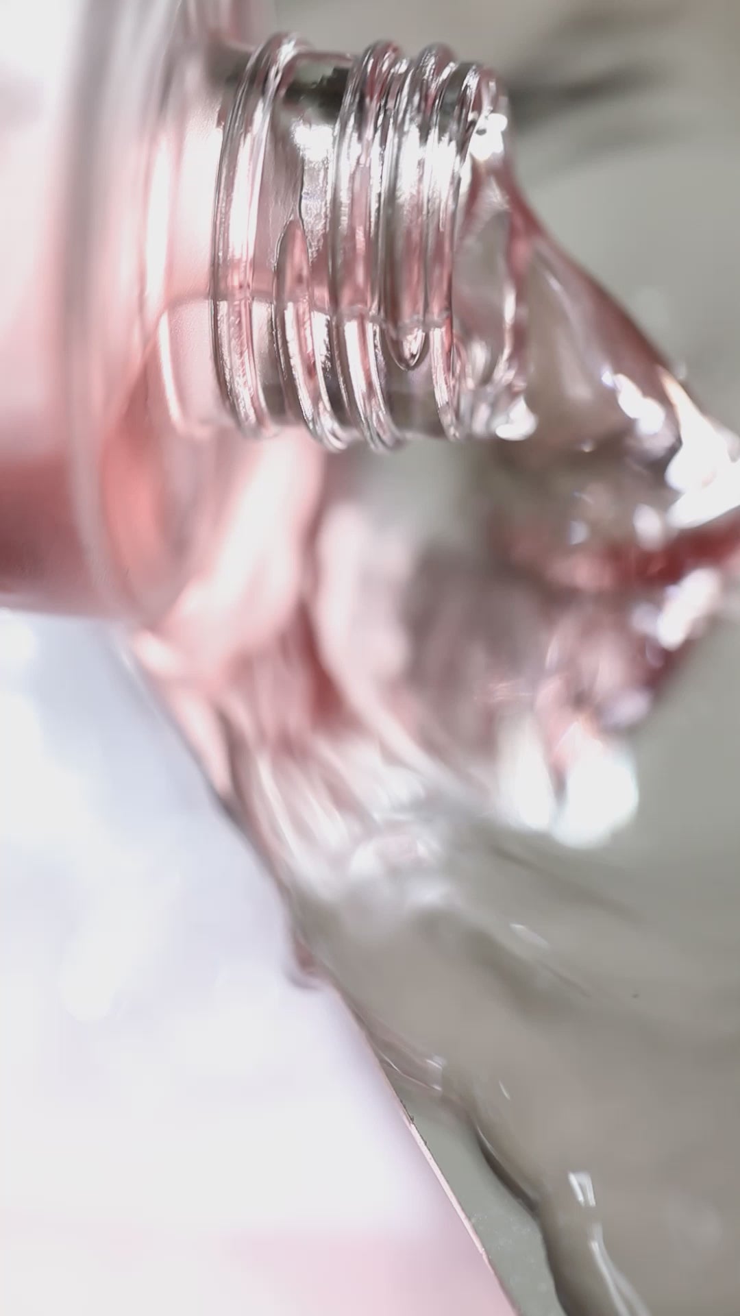 Video of Floral Water Pure Roses Toner pouring out of bottle.